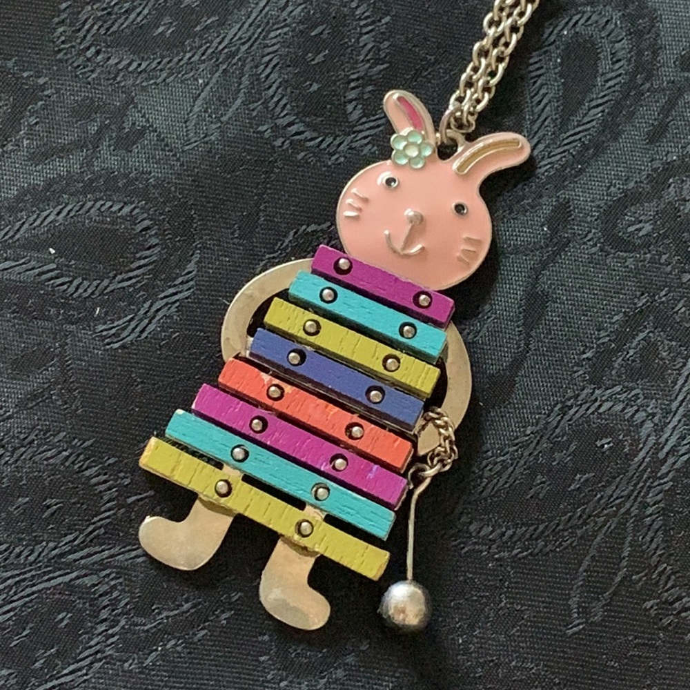 This Necklace Features an Enameled Rabbit Playing a Wooden Colorful Xylophone - Picture 3 of 6